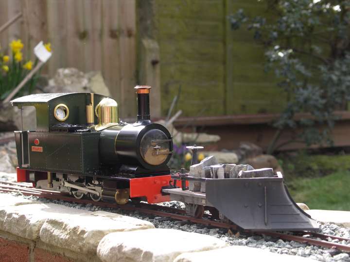 Steam loco pushing a snow plough in sunshine